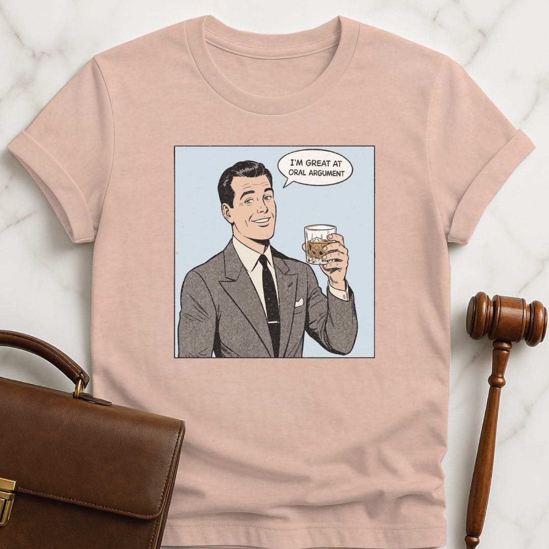 cool attorney graphic tee that says Im Great at Oral Argument featuring man holding a bourbon in heather peach