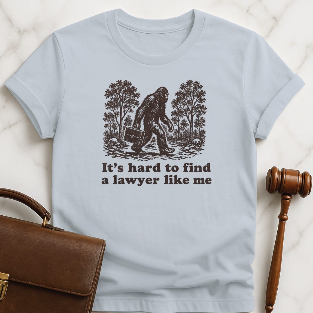 cool law school grad graphic t shirt that says its hard to find a lawyer like me featuring big foot in blue