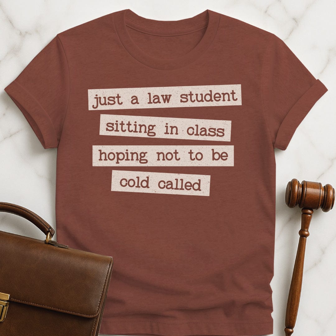 cool law school graphic tee that says just a law student sitting in class in heather brown
