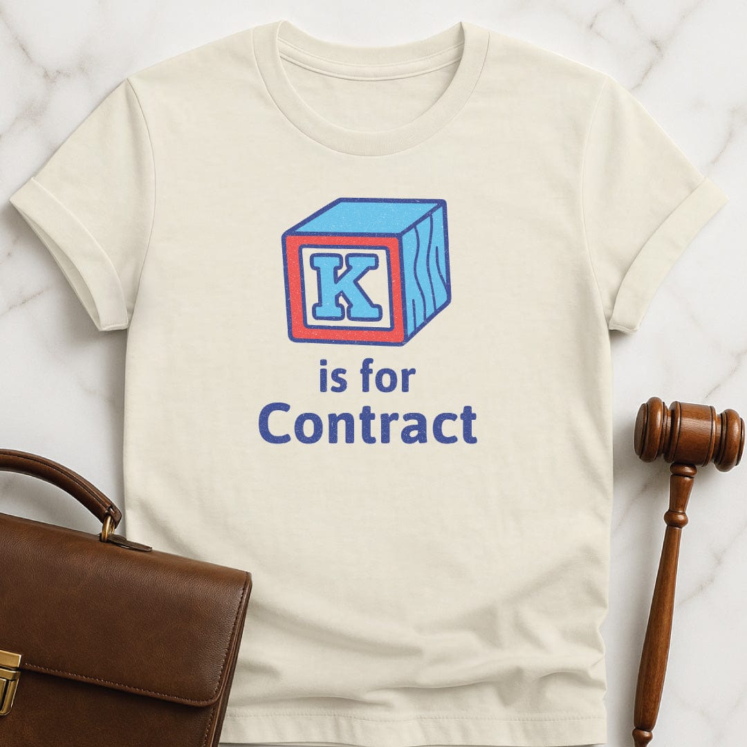 funny lawyer graphic t shirt that says K is for contract featuring k alphabet block in cream