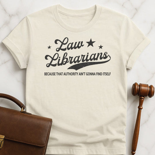 funny lawyer graphic t shirt that says Law Librarians Because That Authority Aint Gonna Find Itself featuring stars in cream