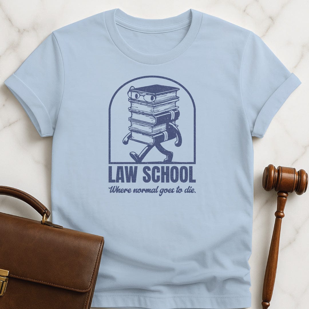 cool law grad graphic tee that says Law School Where Normal Goes to Die featuring pile of books with a face in blue
