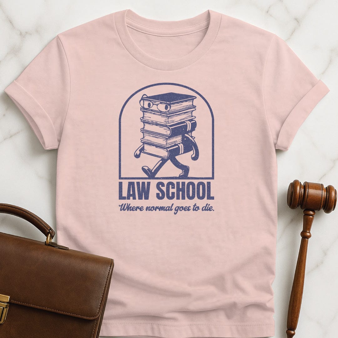 cool law school graduate t shirt that says Law School Where Normal Goes to Die featuring pile of books with a face in pink