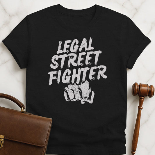 funny law student graphic tee that says Legal streetfighter featuring fist in black