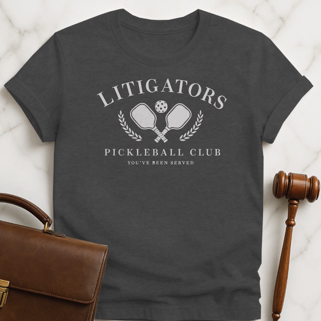 cool law student tee that says litigators pickleball club youve been served featuring pickleball paddles and a pickleball ball and a crest in grey