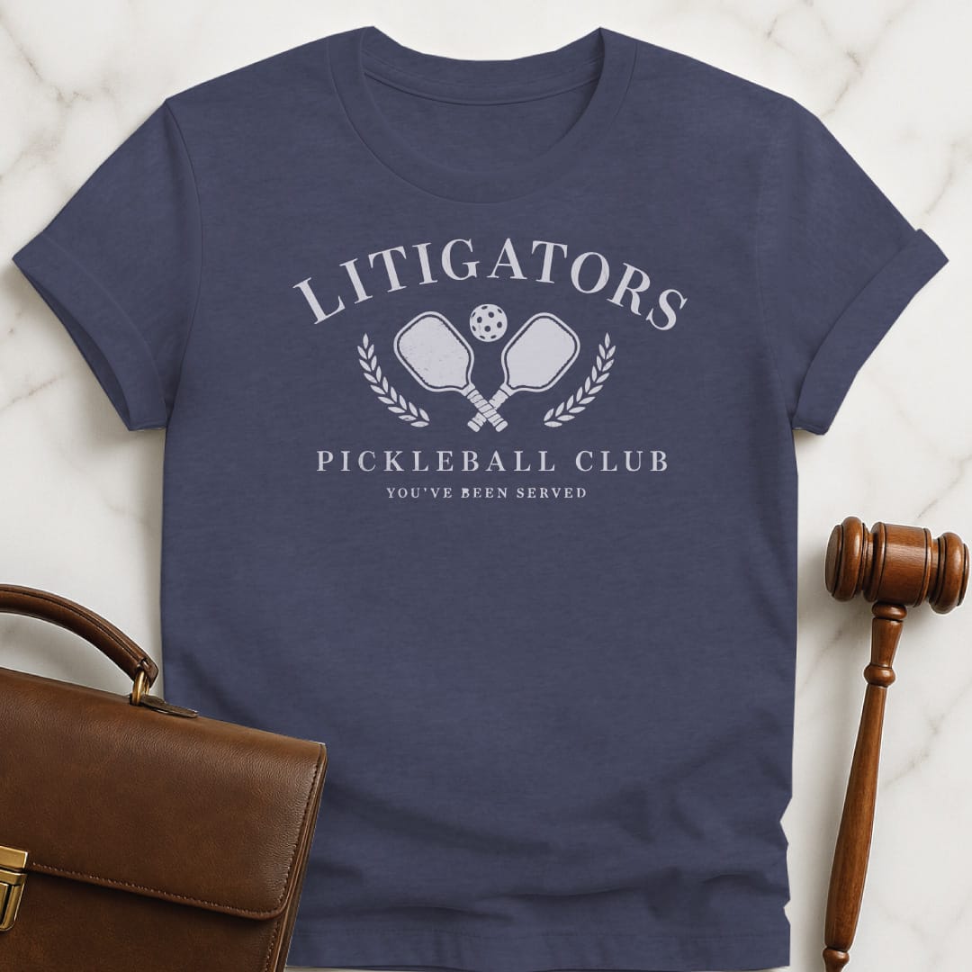 cool law school grad graphic t shirt that says litigators pickleball club youve been served featuring pickleball paddles and a pickleball ball and a crest in heather blue