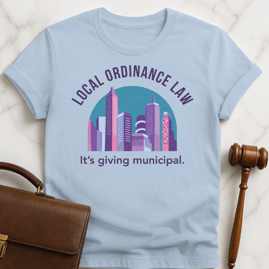funny attorney graphic t-shirt that says Local Ordinance Law Its Giving Municipal featuring city in pastel colors in blue