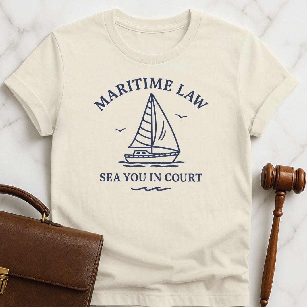 funny attorney tshirt that says Maritime Law Sea you in Court spelled S E A featuring boat in cream