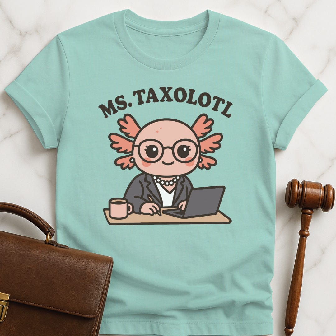 funny law graduate graphic tshirt that says Ms Taxolotl featuring axolotol in a business suit and pearls at a desk with a laptop and a mug in heather green
