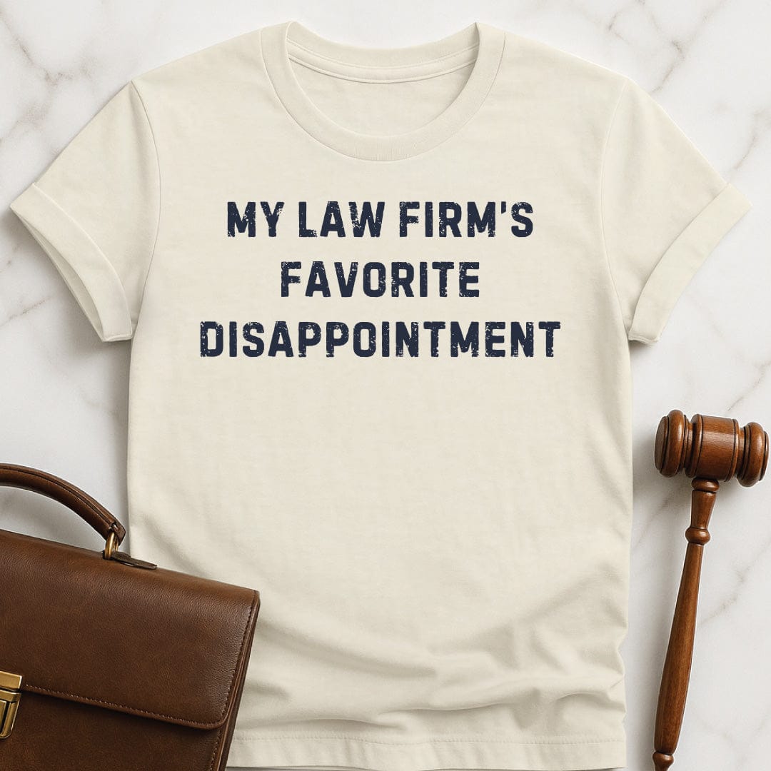 funny attorney graphic tshirt that says my law firms favorite disappointment in cream