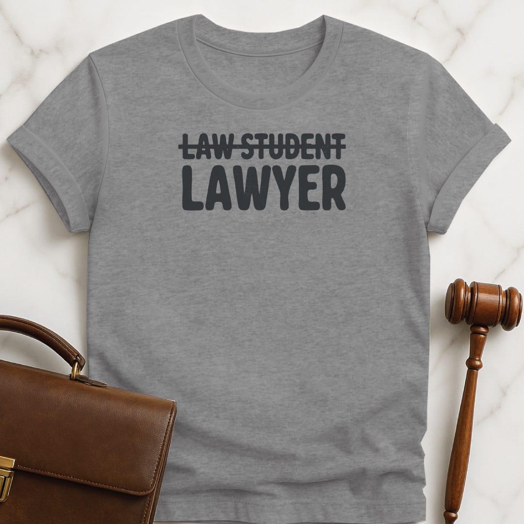 cool law graduate graphic tee that says Law student crossed out lawyer in grey