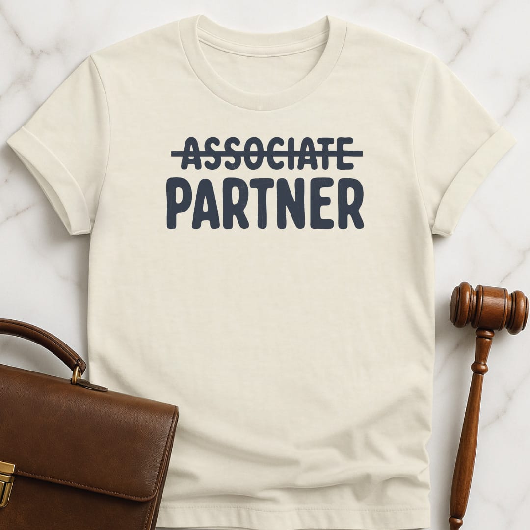 funny lawyer graphic tshirt that says Associate crossed out partner in cream