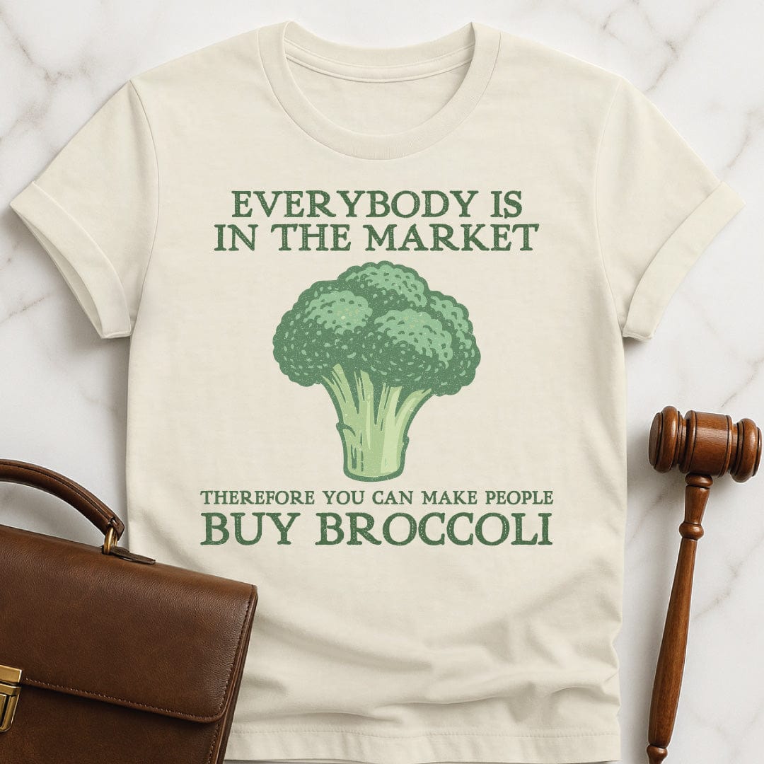 nerdy law school tee that says everybody is in the market therefore you featuring broccoli in cream