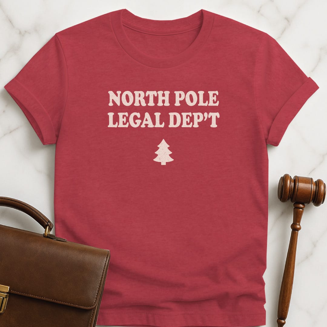 christmas new attorney t-shirt that says North Pole legal department featuring christmas tree in heather red