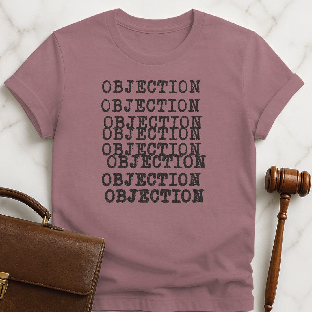 cool law graduate tshirt that says objection written several times in typewriter font in heather mauve