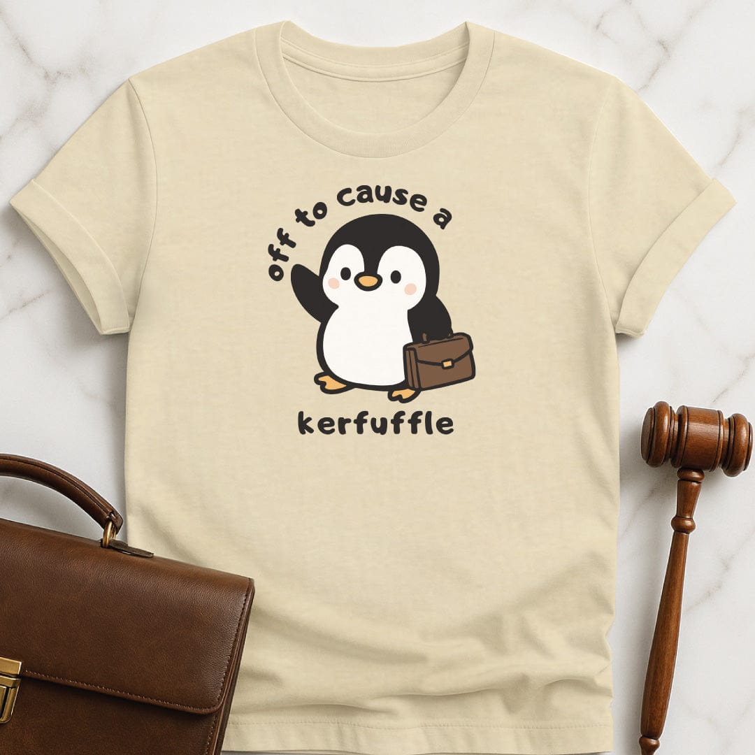cute new lawyer graphic t-shirt that says off to cause a kerfuffle featuring penguin with a brief case in cream