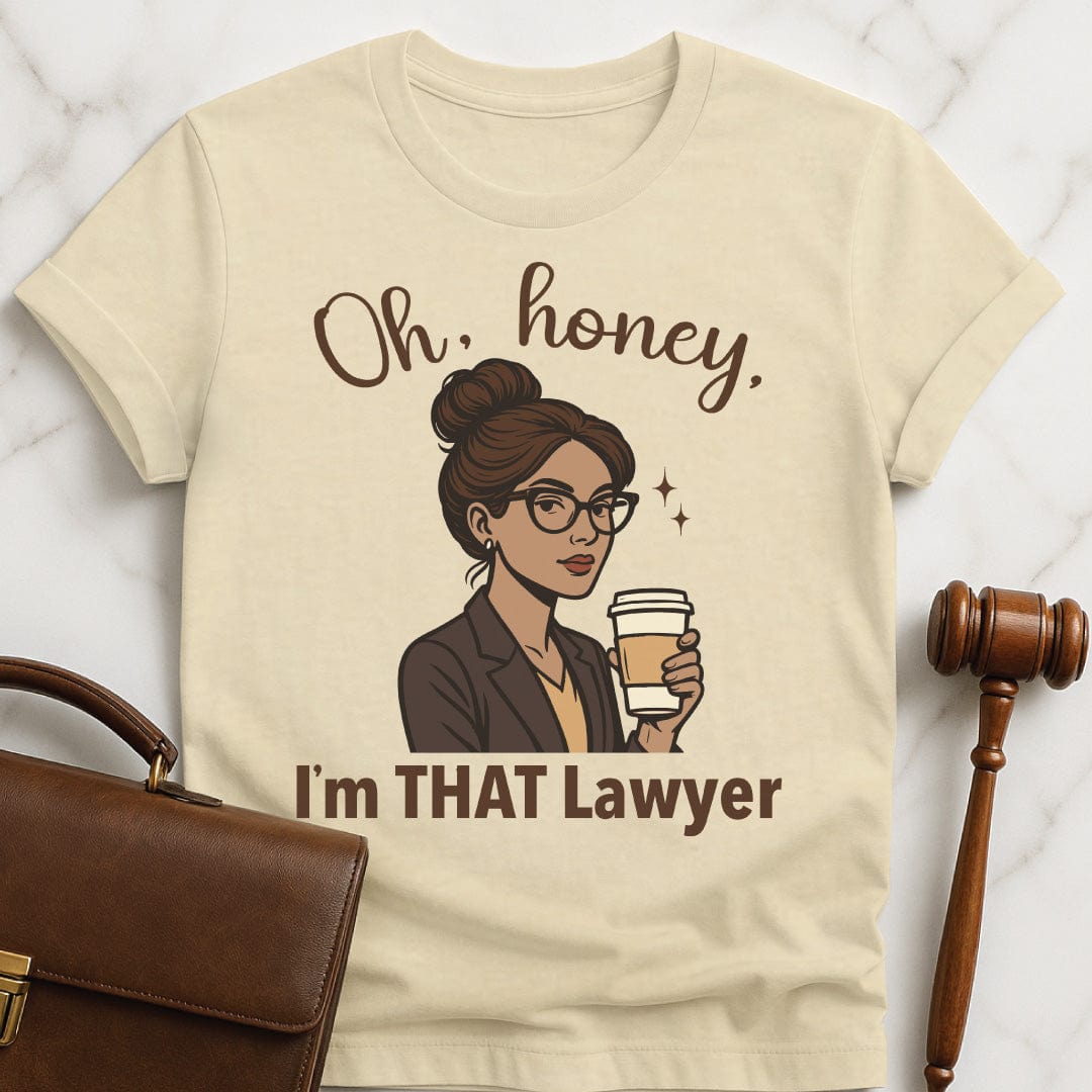 funny law grad t shirt that says oh honey im that lawyer featuring a woman of color with glasses and a gray suit in cream