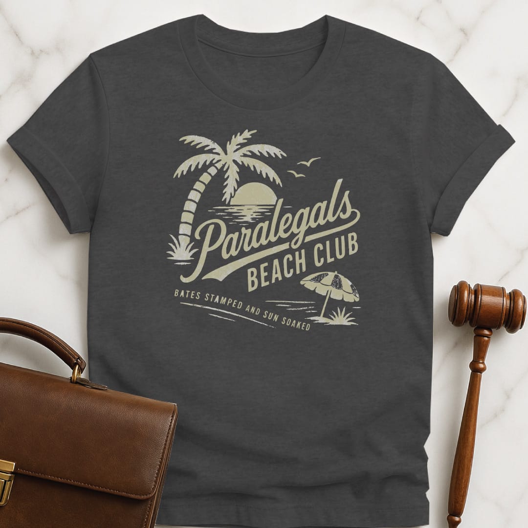 funny lawyer tshirt that says paralegals beach club bates stamped and sun soaked featuring beach scene in grey