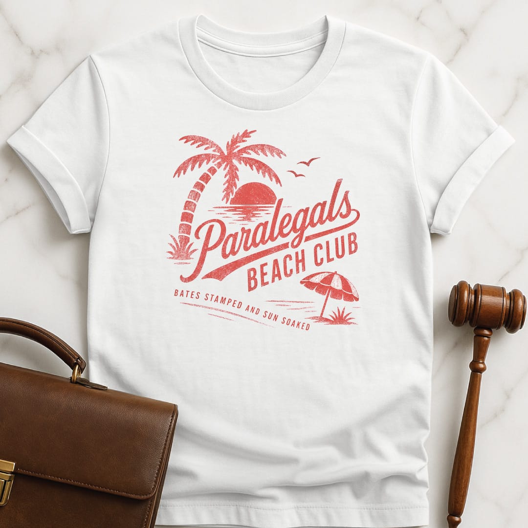 cool attorney graphic t shirt that says paralegals beach club bates stamped and sun soaked featuring beach scene in white