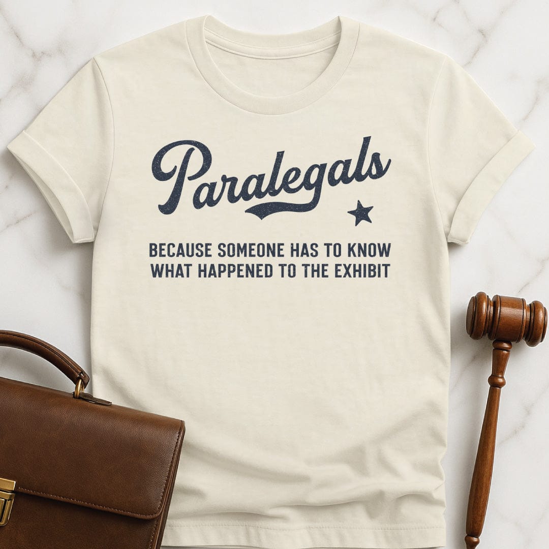 funny attorney tshirt that says Paralegals because someone has to know what in cream