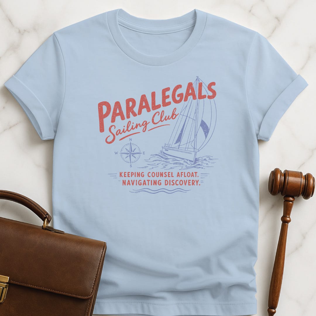 cool attorney tee that says paralegals sailing club navigating discovery keeping counsel afloat featuring boat in blue