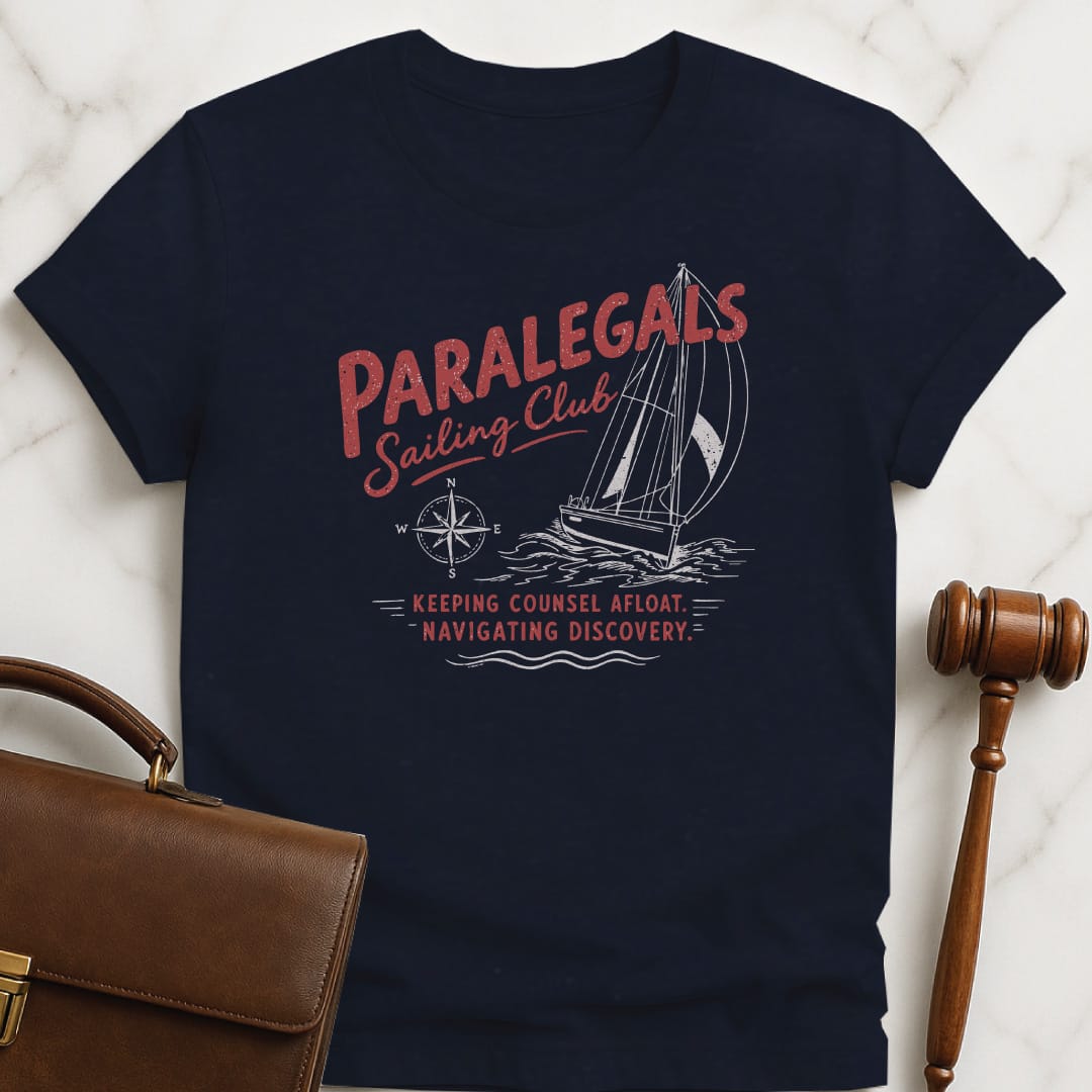 cool attorney graphic tee that says paralegals sailing club navigating discovery keeping counsel afloat featuring boat in blue
