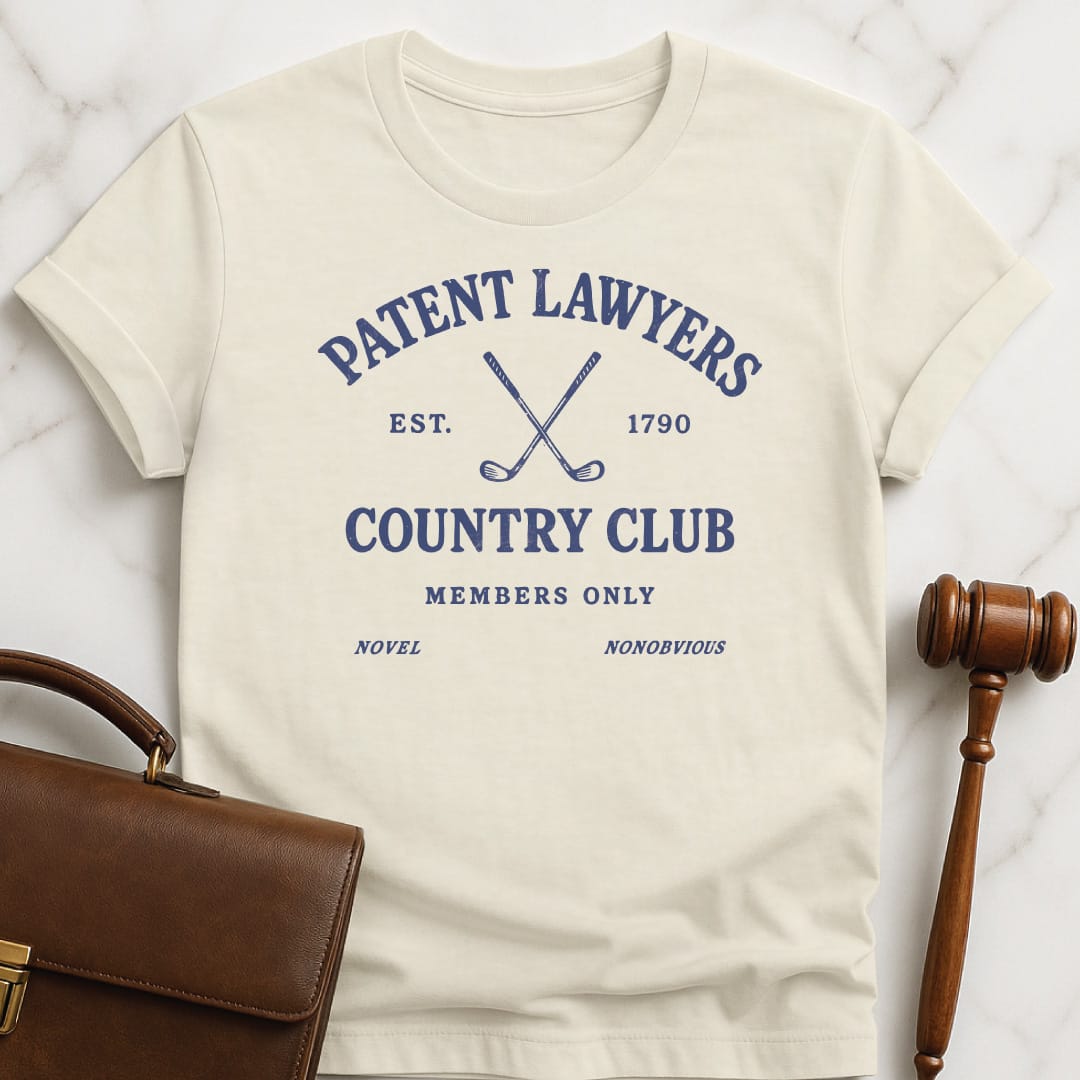 cool law grad graphic t shirt that says Patent Lawyers Country Club Est 1790 novel nonobvious members only featuring golf clubs in cream