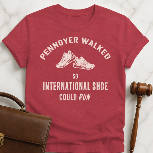 funny law school grad graphic tshirt that says pennoyer walked so international shoe could run featuring vintage style sneakers in heather red