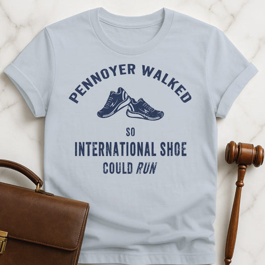 nerdy law school graduate graphic t shirt that says pennoyer walked so international shoe could run featuring vintage style sneakers in blue