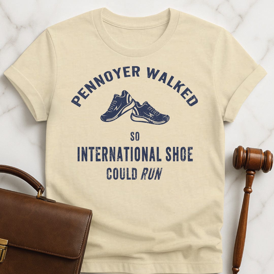 funny attorney graphic tshirt that says pennoyer walked so international shoe could run featuring vintage style sneakers in cream