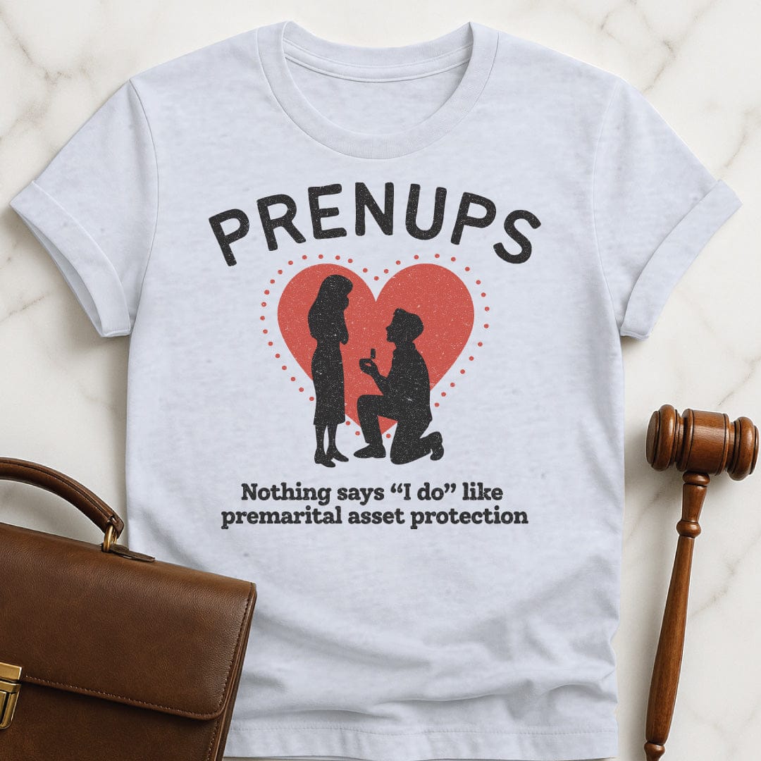 funny attorney tshirt that says Prenups Nothing Says I Do Like Premarital Asset Protection featuring Man proposing to woman with a heart in grey