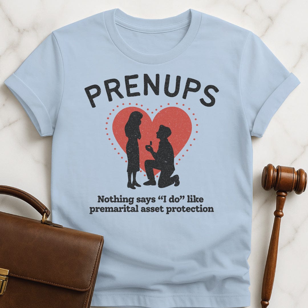funny new attorney graphic tshirt that says Prenups Nothing Says I Do Like Premarital Asset Protection featuring Man proposing to woman with a heart in blue
