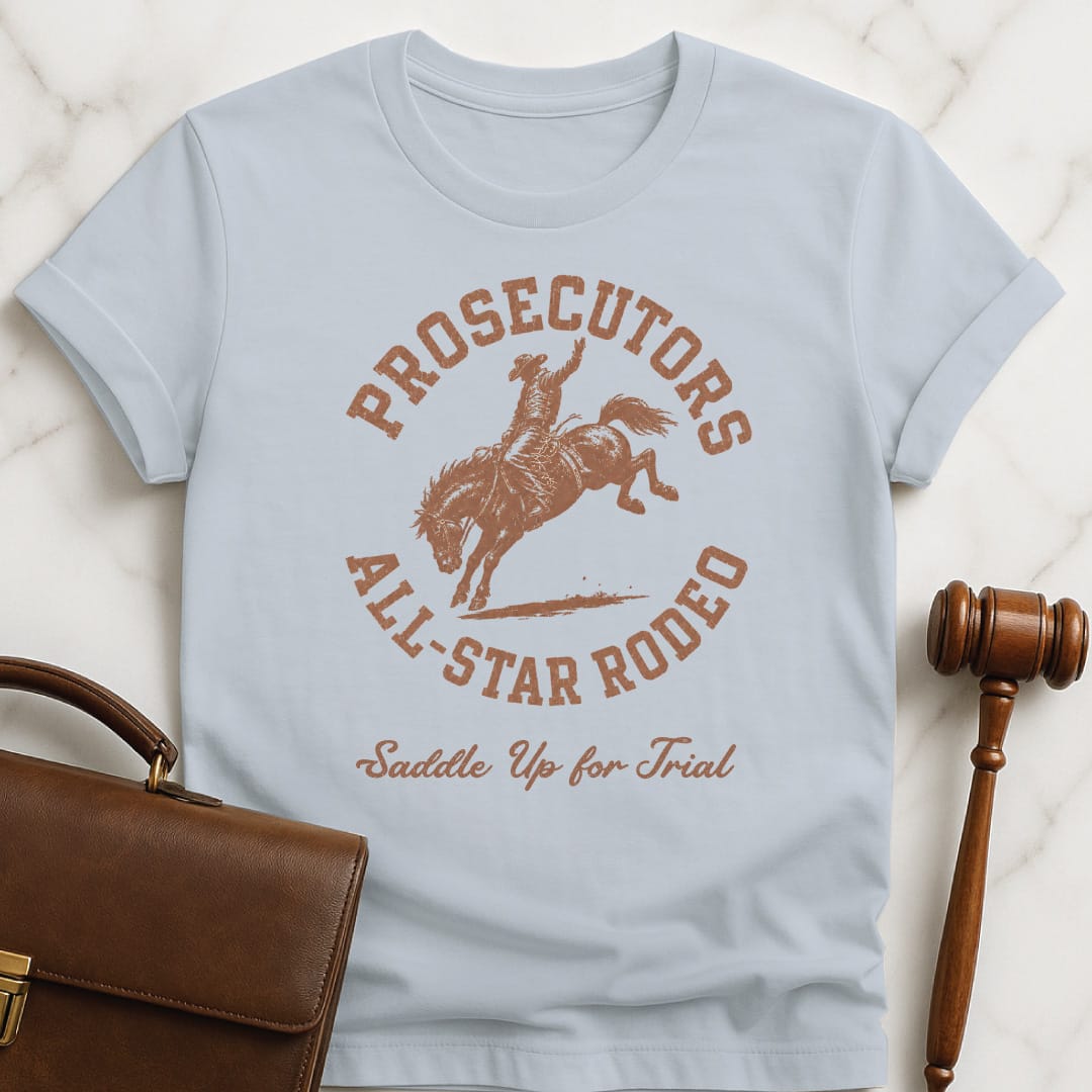 funny lawyer graphic tshirt that says prosecutors all star rodeo saddle up for trial featuring rodeo image in blue