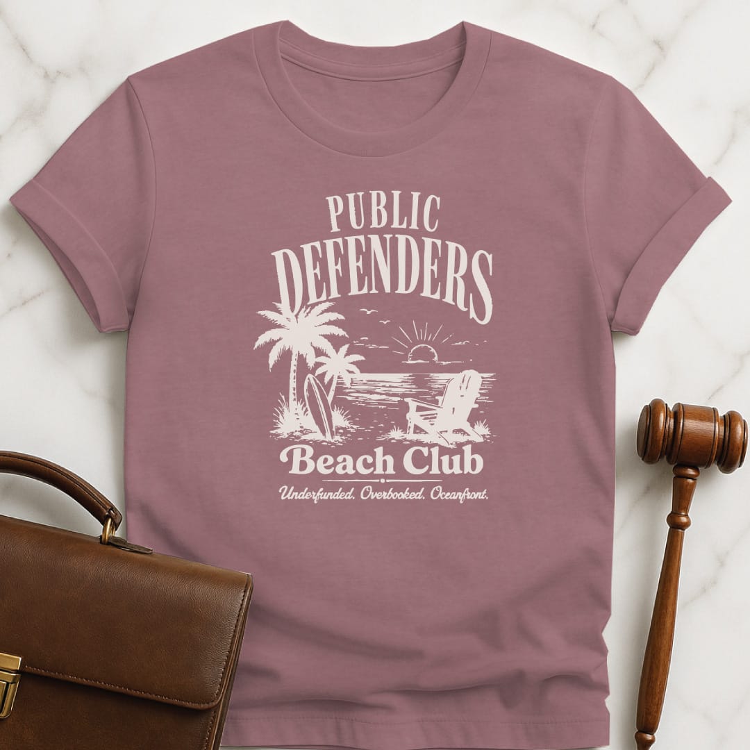 cool law student t shirt that says Public defenders beach club underfunded overbooked oceanfront featuring beach with palm trees and beach chairs in heather mauve