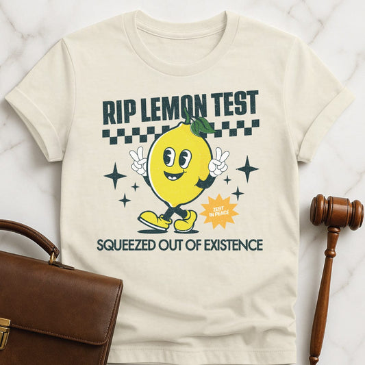 funny attorney graphic tshirt that says rip lemon test squeezed out of existence zest in peace featuring a cute lemon with a face and arms and legs in cream