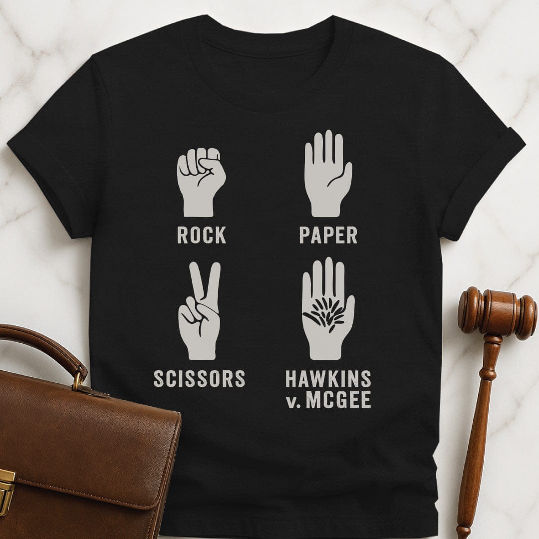 funny law student t-shirt that says rock paper scissors hawkins v mcgee featuring a hand in a fist a hand with flat palm a hand with two fingers up in a V and a hairy palm in black