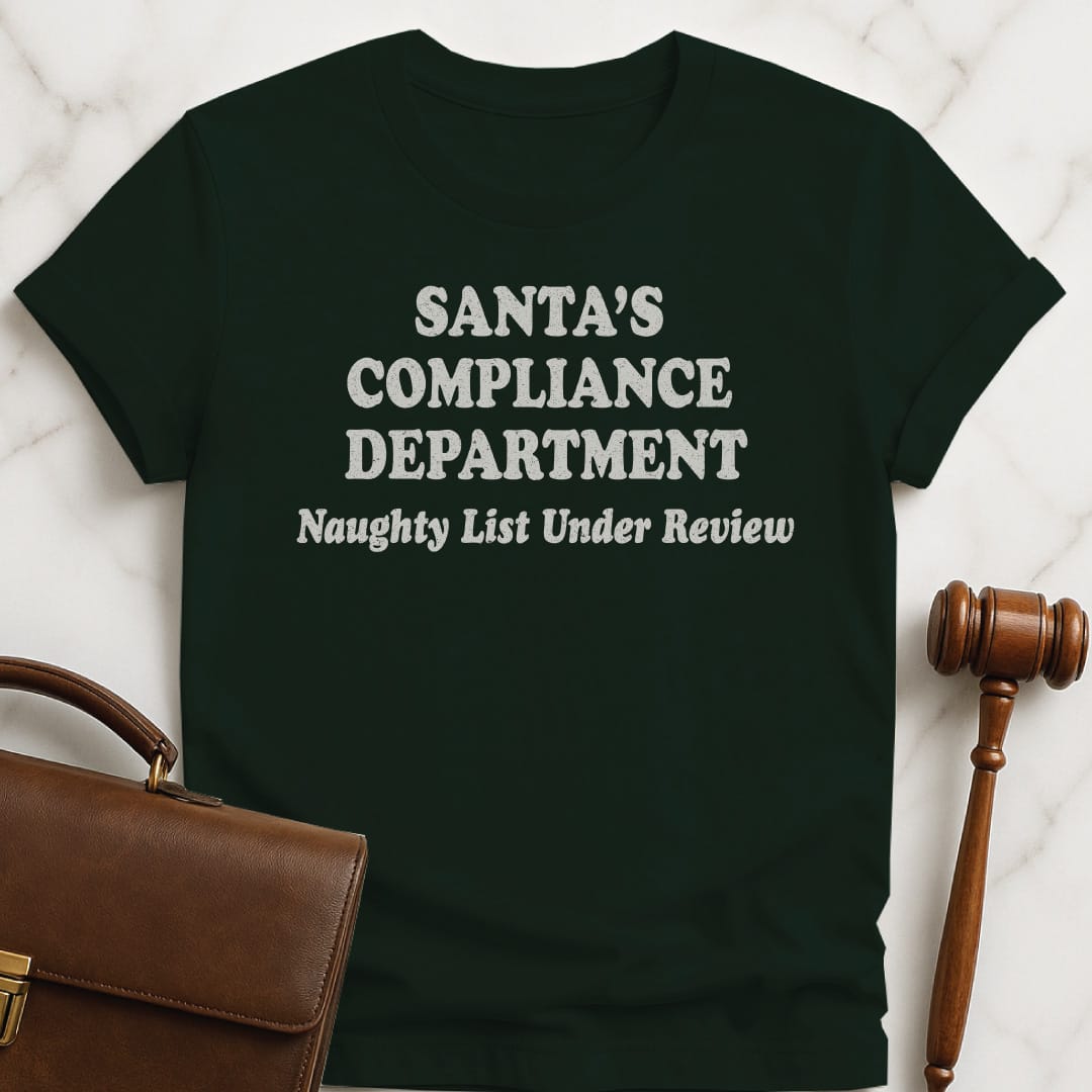 christmas new attorney graphic tshirt that says Santas Compliance Department Naughty List Under Review in green