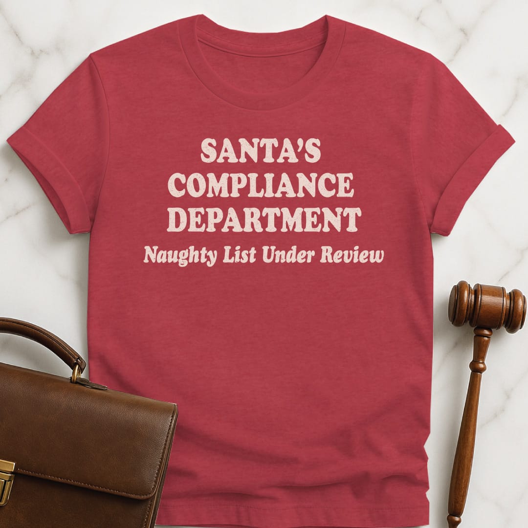christmas attorney t-shirt that says Santas Compliance Department Naughty List Under Review in heather red