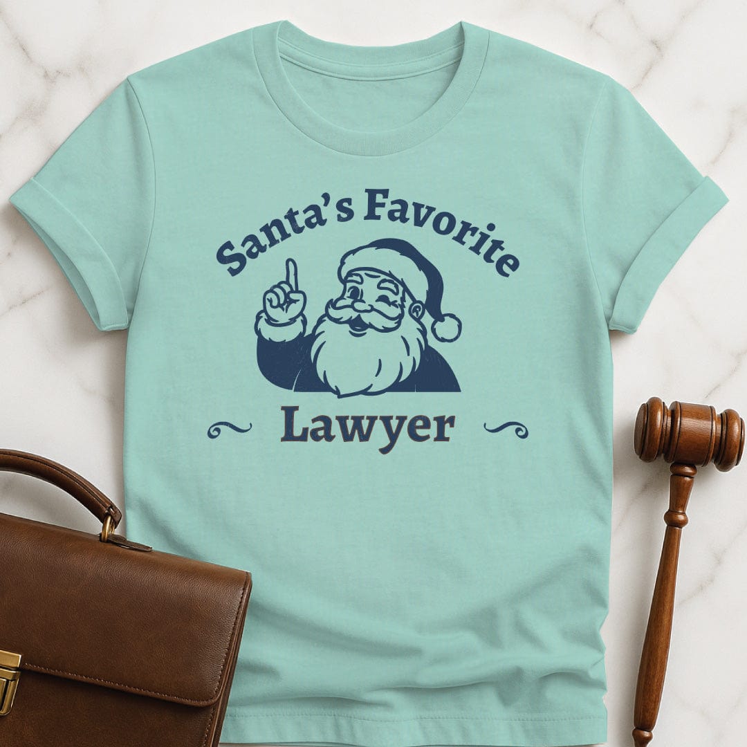 santa law school graduate tee that says Santas Favorite Lawyer featuring Santa holding up a finger in heather green