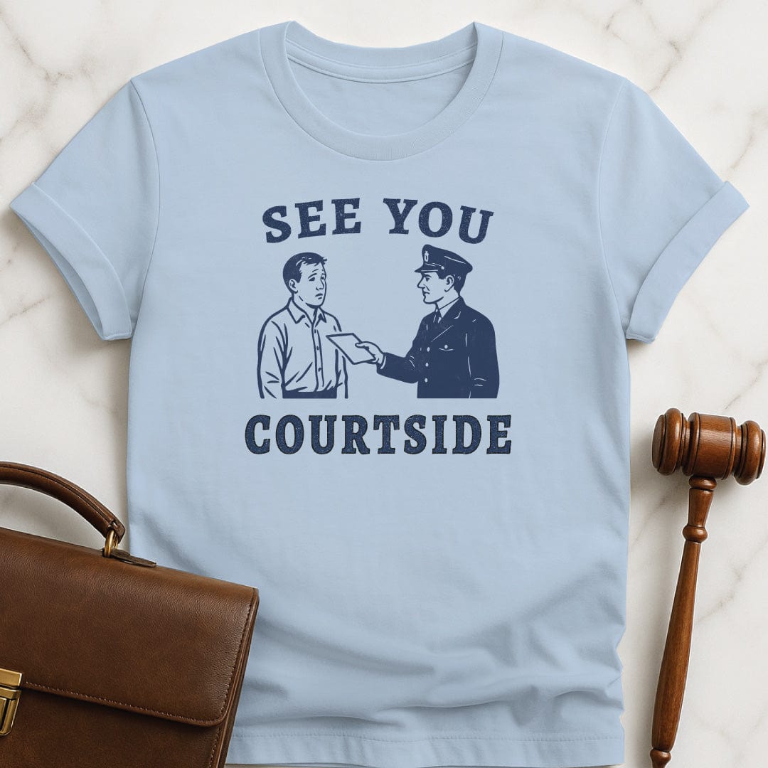 unique lawyer graphic t shirt that says See You Courtside featuring police officer handing a person a piece of paper in blue