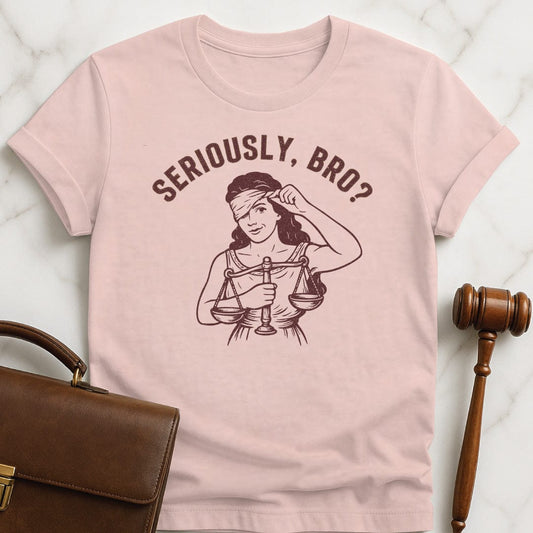 trendy attorney graphic tshirt that says Seriously bro featuring Lady justice smirking in pink