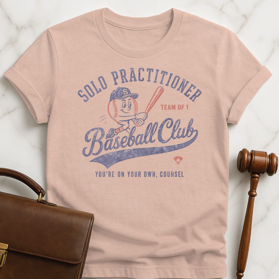 funny lawyer graphic tshirt that says Solo Practitioner Baseball Club Youre On Your featuring cute baseball holding a bat in heather peach