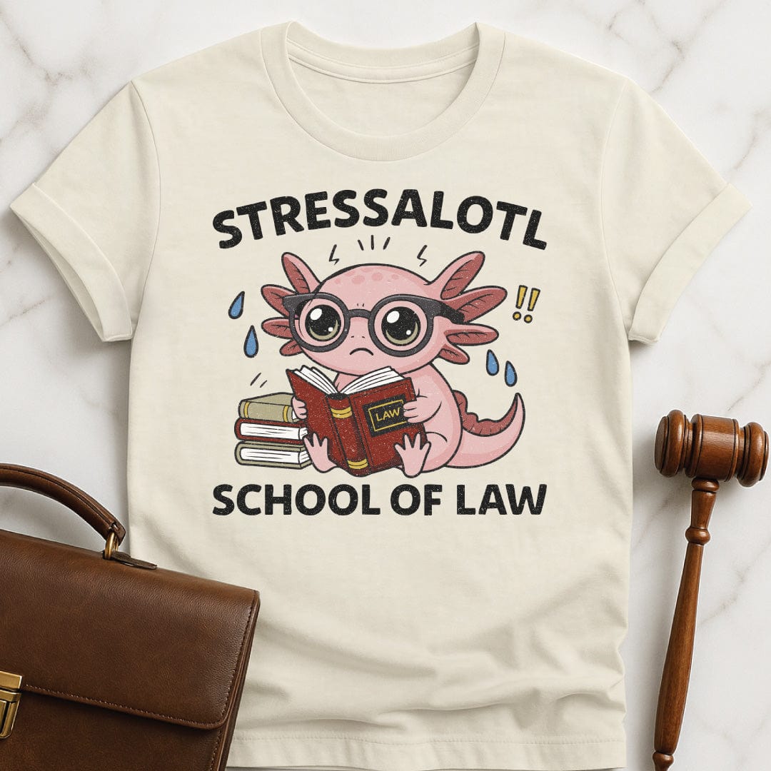 funny law graduate t-shirt that says stressalotl school of law featuring a stressed axolotl surrounded by law school case books in cream