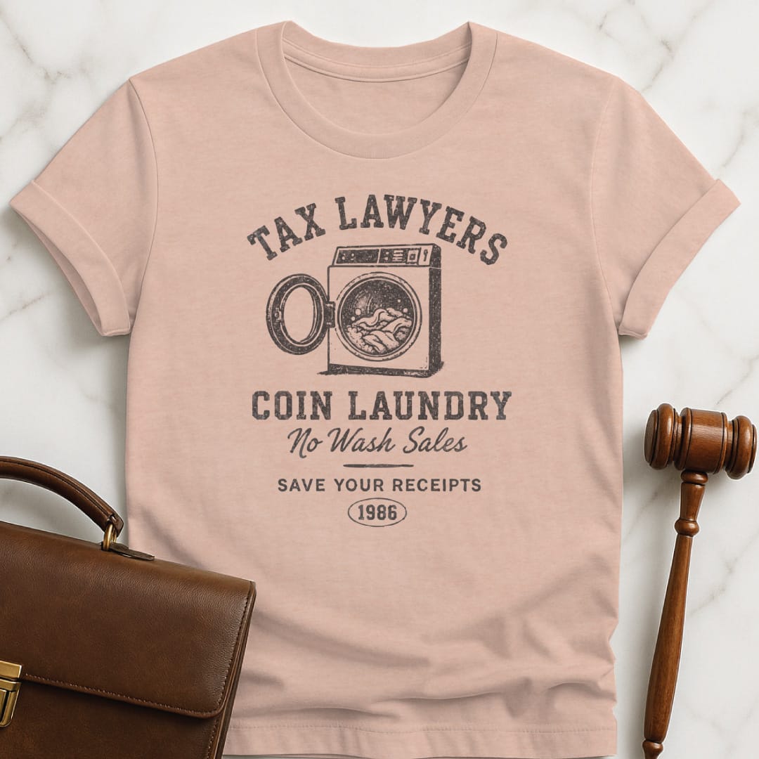 cool lawyer graphic tee that says tax lawyers coin laundry no wash sales featuring washing machine in heather peach