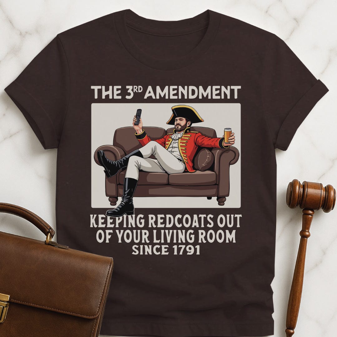 funny law graduate t-shirt that says third amendment keeping redcoats out of your featuring a man in british revolutionary uniform sitting on couch drinking a beer and holding a remote control in brown