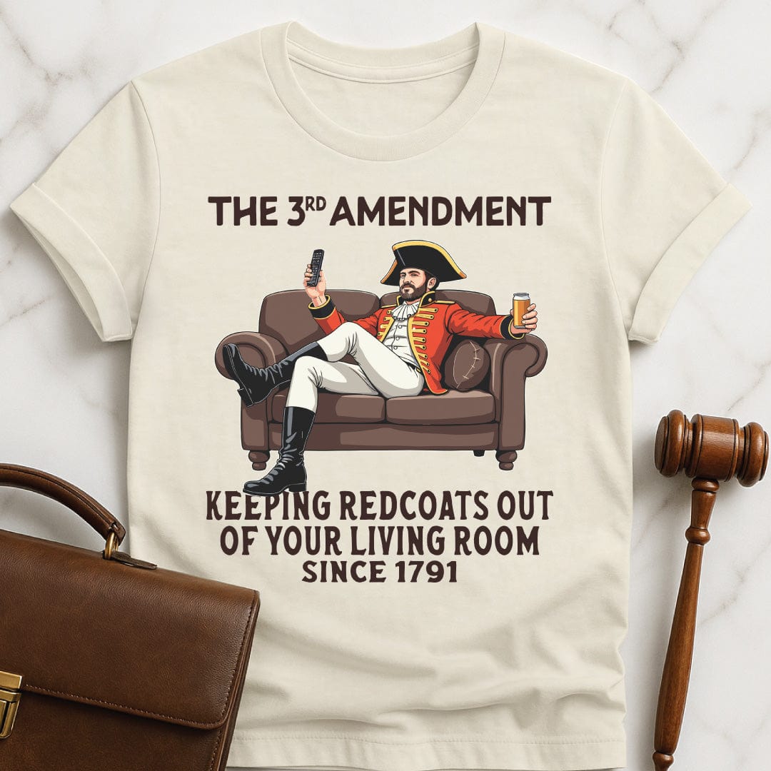 funny new attorney graphic tshirt that says third amendment keeping redcoats out of your featuring a man in british revolutionary uniform sitting on couch drinking a beer and holding a remote control in cream