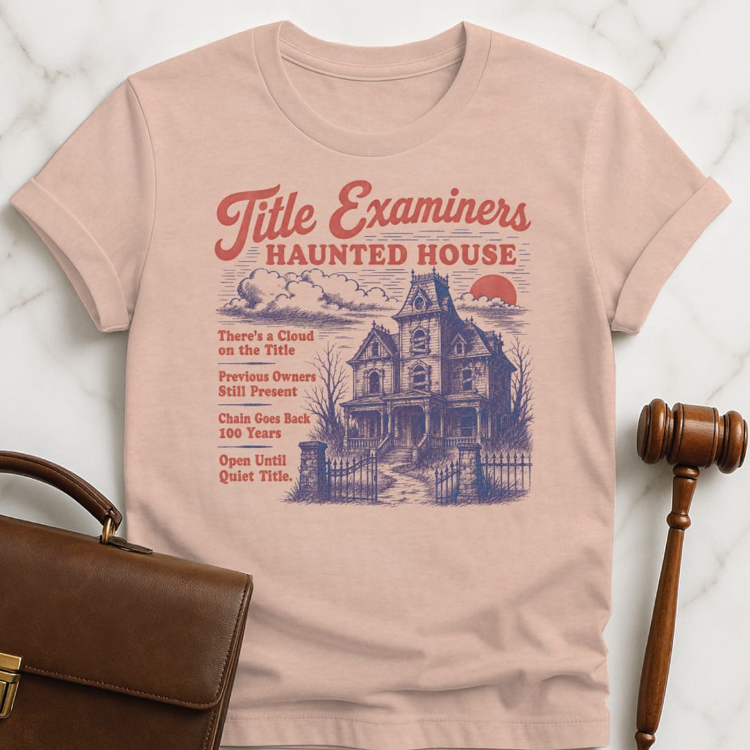funny lawyer graphic t-shirt that says title examiners haunted house theres a cloud in heather peach