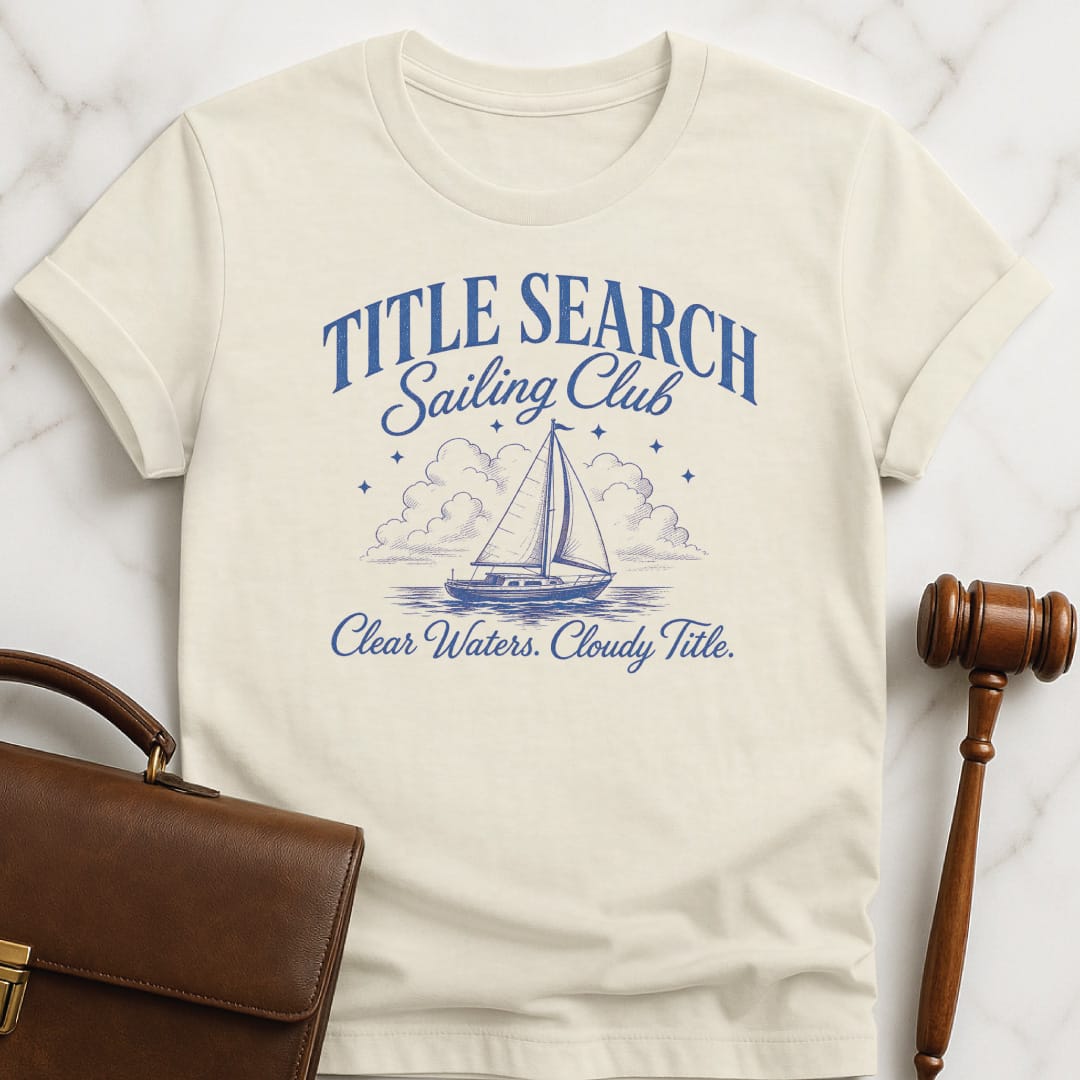 funny attorney t-shirt that says Title search sailing club clear waters cloudy title featuring sailboat clouds and stars in cream
