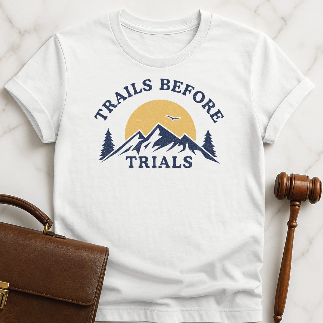 cool attorney graphic t-shirt that says trails before trials featuring mountain sun and a flying bird in white