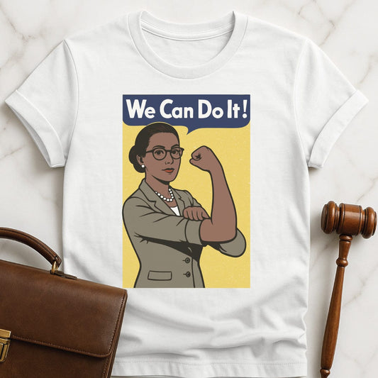 feminist law school tee that says We can do it featuring a woman in a suit posing like Rosie the Riveter with a yellow background in white
